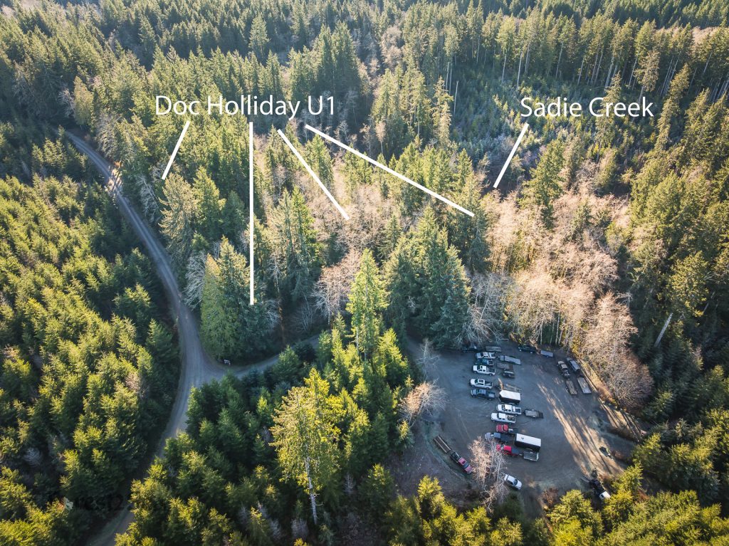 Aerial view of a campground, surrounded by forest