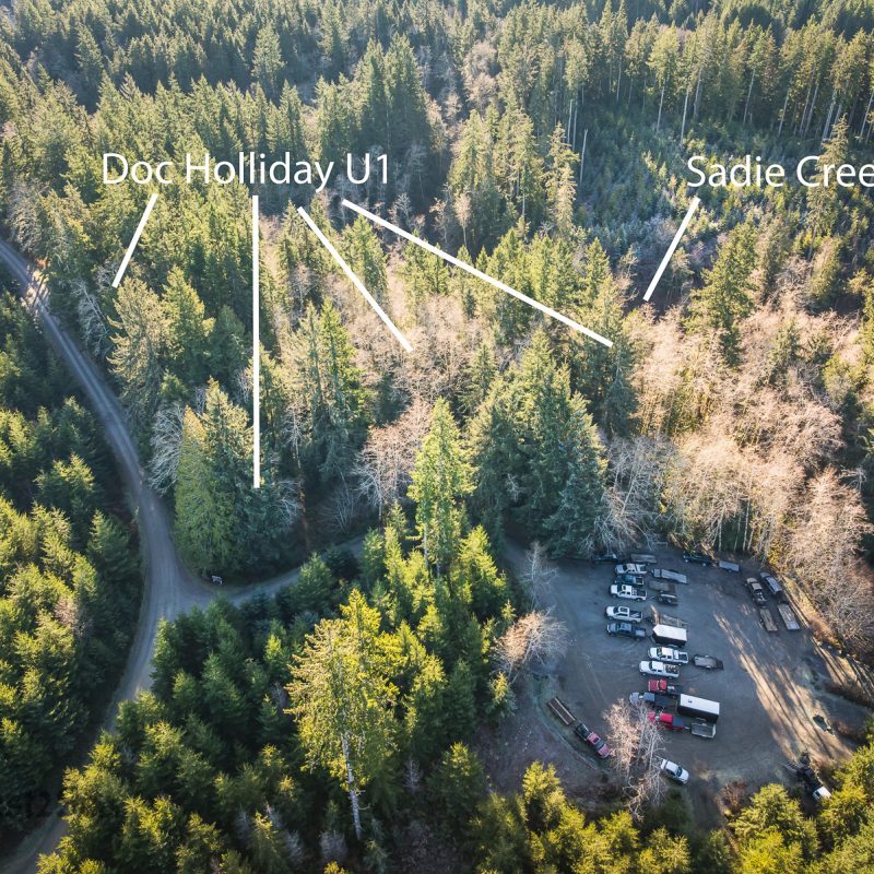 Aerial view of a campground, surrounded by forest